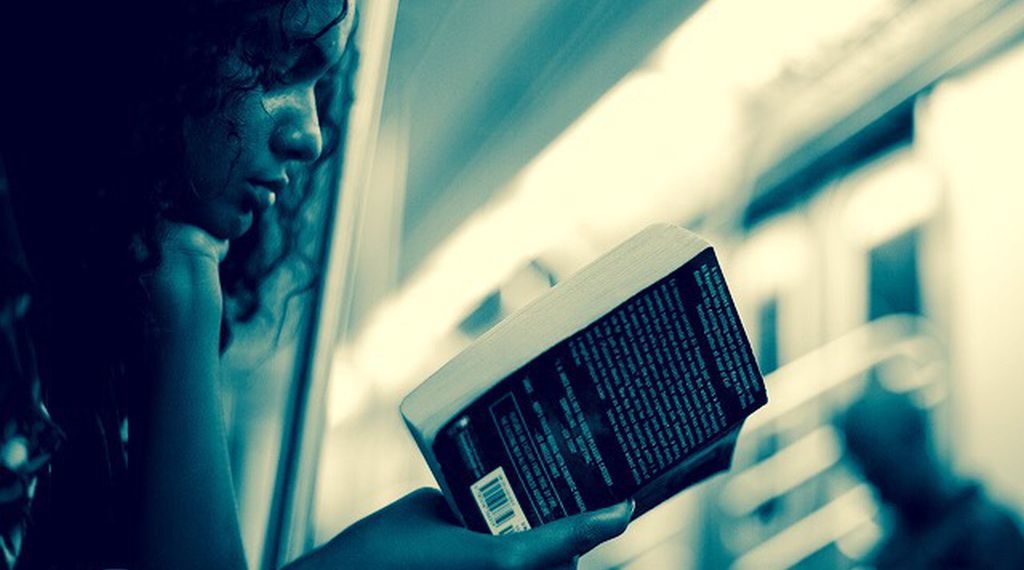 A woman reads a book as she rides the subway in New York City on July 18, 2010. For more subway shots, please see my subway set: www.flickr.com/photos/pamhule/sets/72157623210921064/ © 2010 Jens Schott Knudsen | blog.pamhule.com